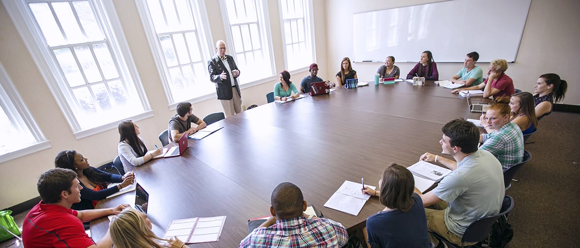 Several students at large round table