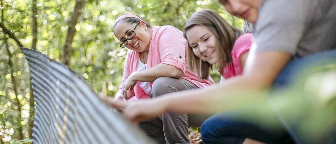 Students outside learning with teacher