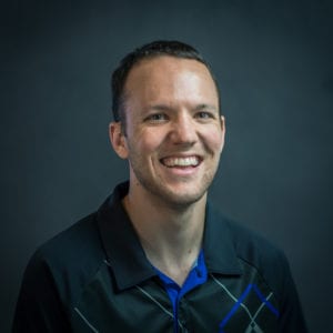 Headshot of James Sweeney