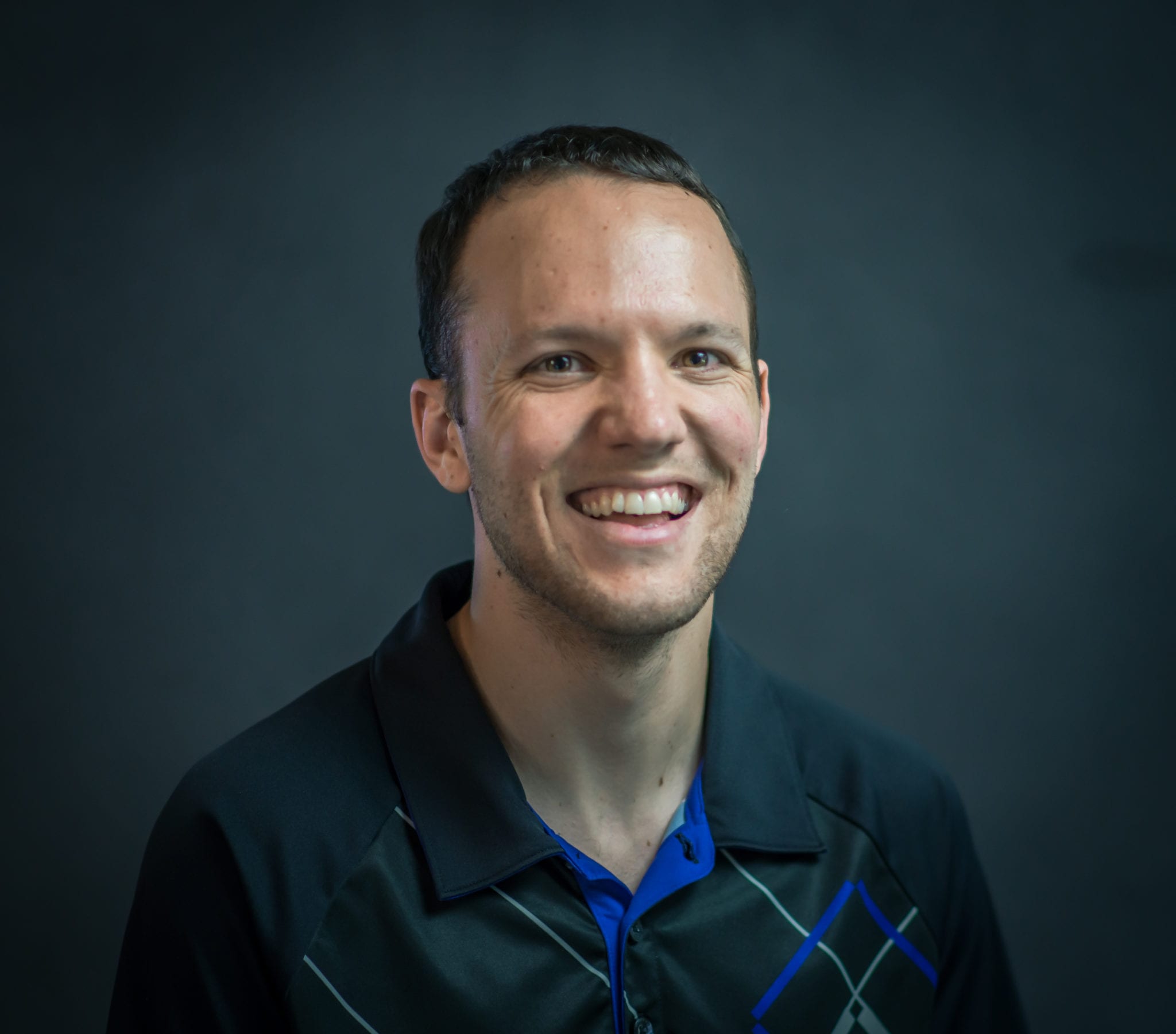 Headshot of James Sweeney