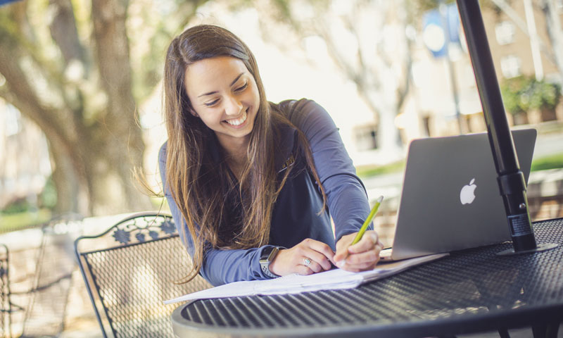 Female student working outside