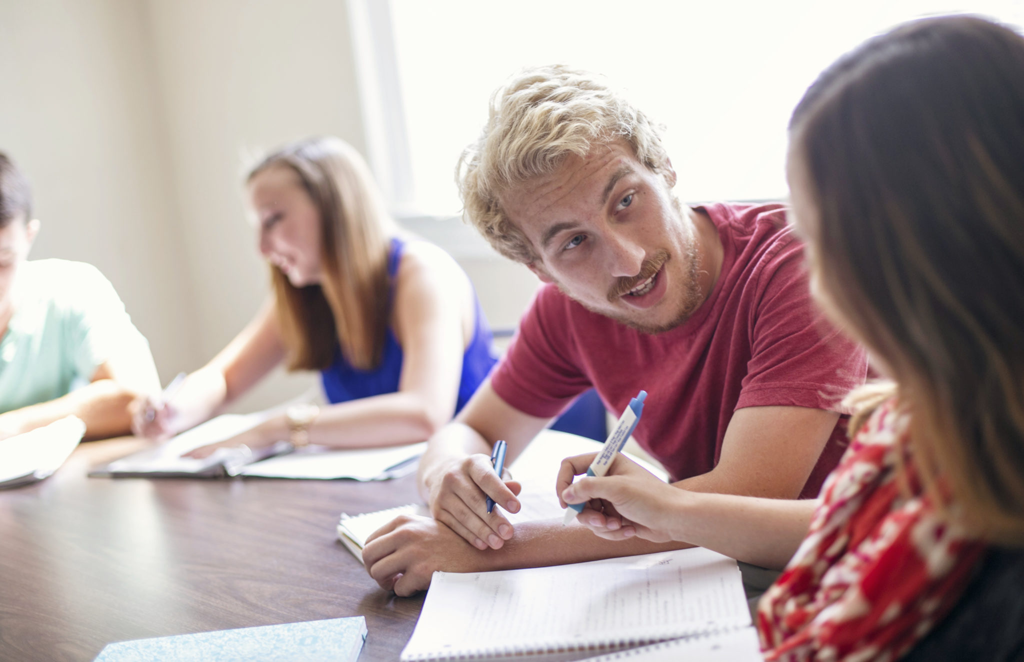 A student helping someone with school work.