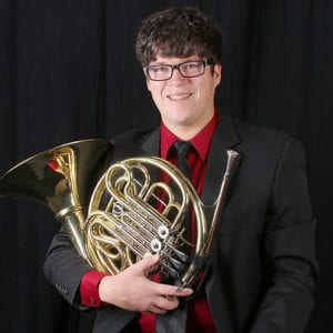 Nicholas Fife holding a French horn