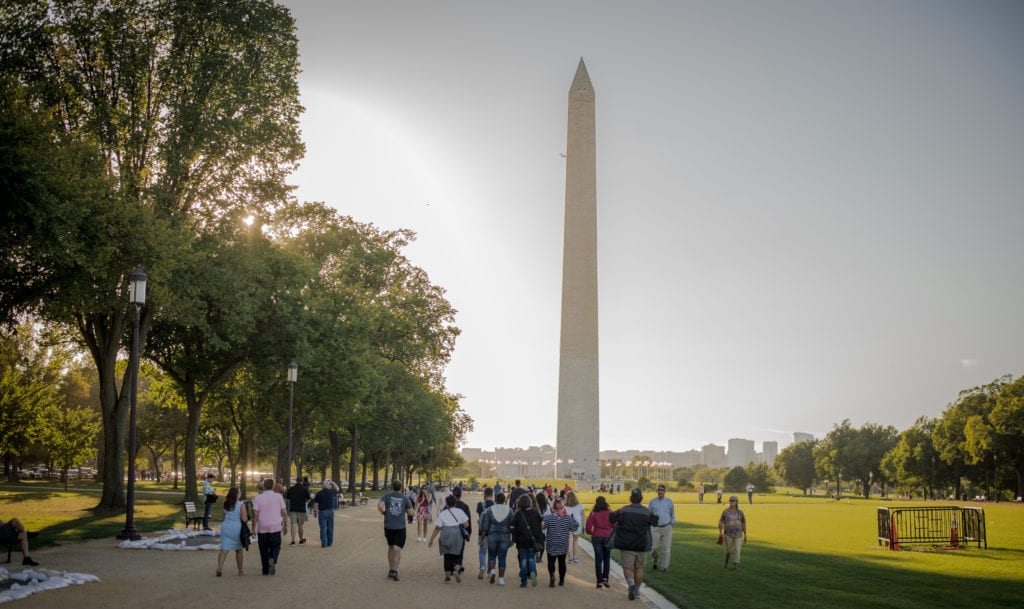 Coker Students walking the National Mall, with the Washington Monument in the background.