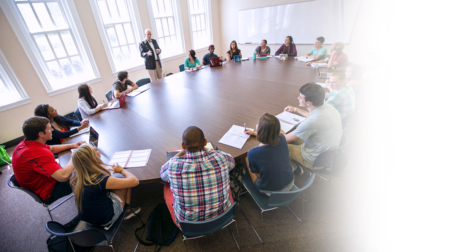 Students and Professor at a large round table.