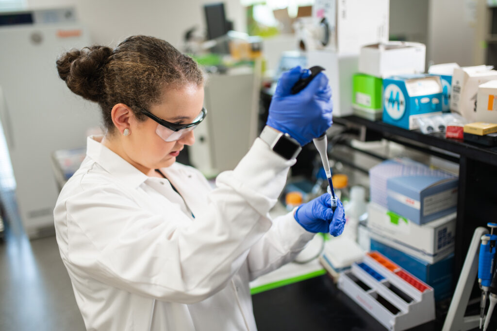 a student in a labcoat